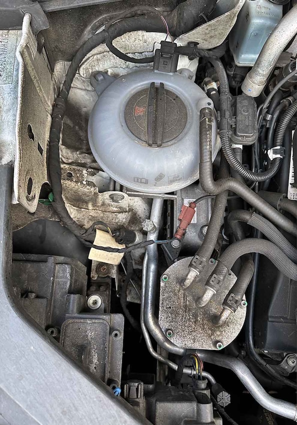 Undercarriage before cleaning — corrosion, salt, and grime deposits